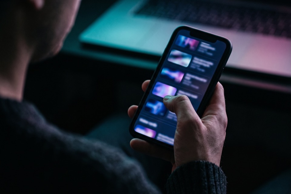 Scrolling a long list of reposted videos on a phone