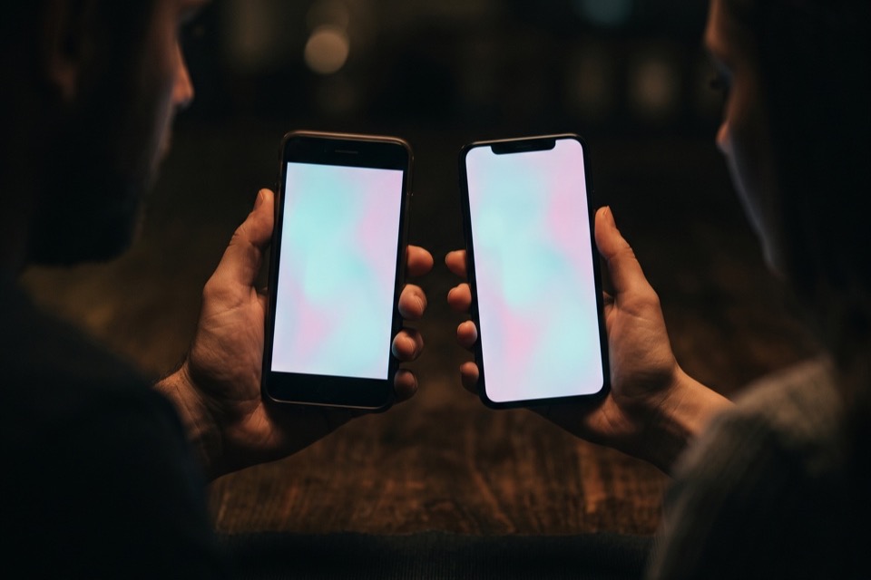 Two phones held facing each other